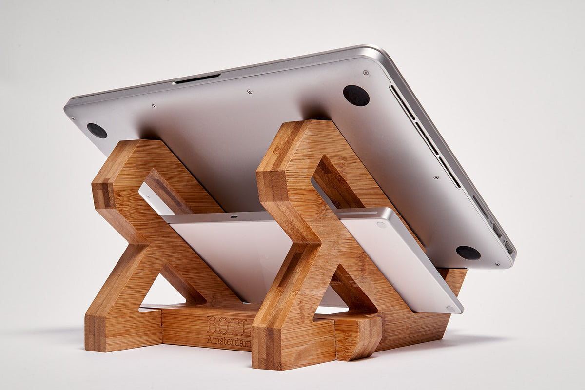 Bamboo Laptop Stand on a desk, with a keyboard stored below