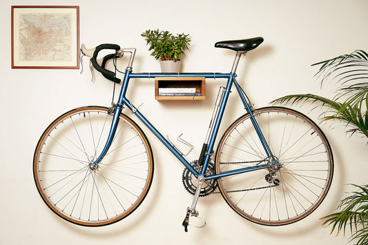 A BOTL Amsterdam #1 oak wood bike hanger mounted on the wall