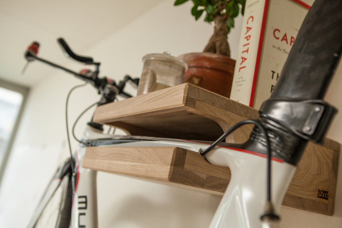 Close-up of the natural wood grain on the unfinished oak Bike Wall Hanger #1